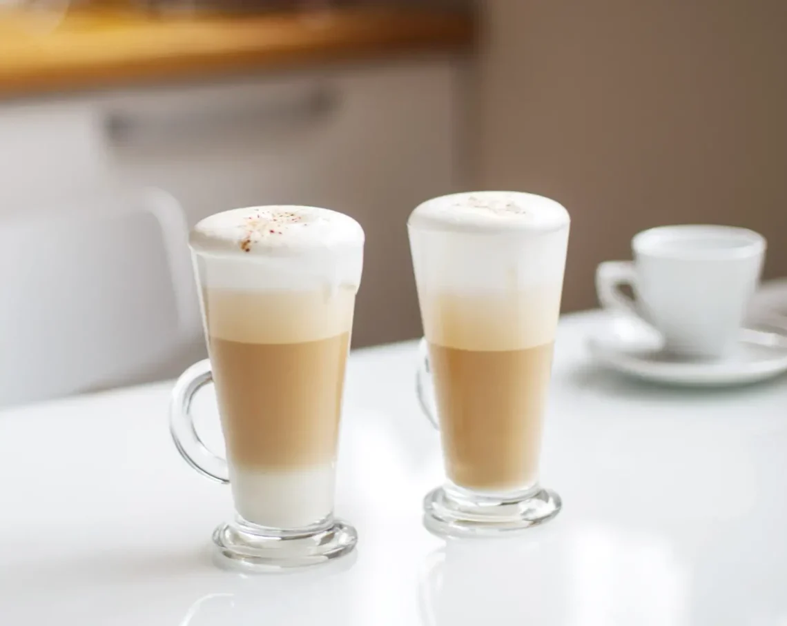 two cups of latte coffee on the table. morning breakfast.